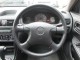 Характеристики автомобиля Mazda Familia 1.3 DX (06.2004 - 12.2006): фото, вместимость, скорость, двигатель, топливо, масса, отзывы
